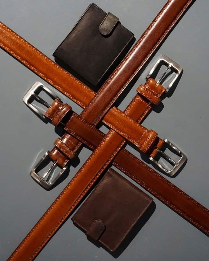 Hands working on leather craftsmanship
